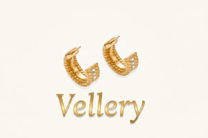 Textured gold huggie hoop earrings with raised ribbed rows creating dimensional sculptural design on cream background